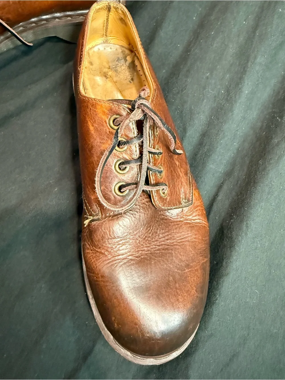 Vintage Dr. Martens Made in England (MIE) brown leather shoes.